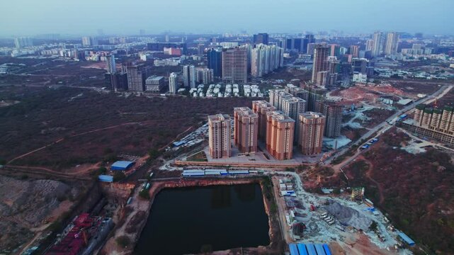 aerial view of nanakramguda, financial district with Hillcrest by Pacifica buildings and trees at day time, push in, drone shot, 4k.