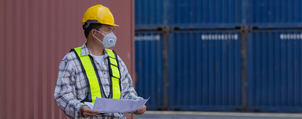 Foreman or worker work at Container cargo site check up goods in container. Foreman or worker checking on shipping containers. Logistics and shipping.