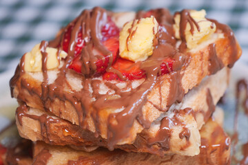 Chocolate banana-strawberry toast for a tasty breakfast