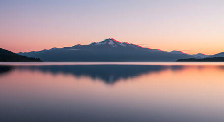 Majestic Mountain Reflections At Tranquil Lake During Soft Pastel Sunset