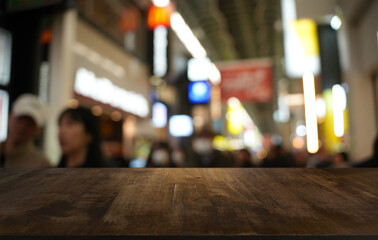 Empty wood table top and blur of restaurant background selective focus product display