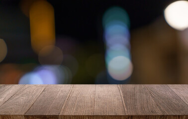 Empty wood table top and blur of restaurant background selective focus product display