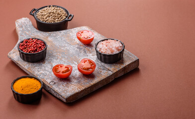 Empty wooden cutting board on a monochrome brown background