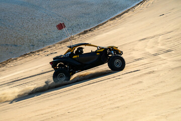Doha, Qatar : Off road buggy car in sand dunes of the Qatari desert.