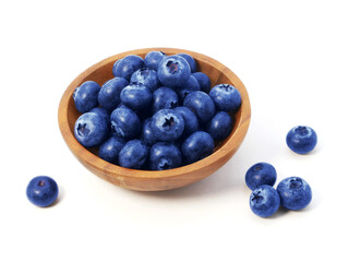 Blueberries in wooden bowl isolated on white background