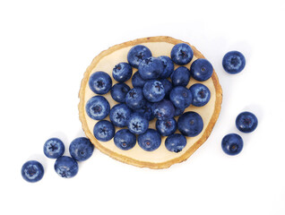 Blueberries in wooden tray isolated on white background