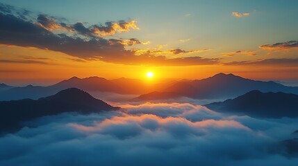 Obraz premium Sunrise Over Mountain Peaks with Rolling Fog