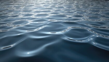 Naklejka premium Blue ocean waves ripple across the abstract water surface, reflecting the natural light