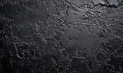 Fototapeta premium Abstract dark texture background with a rugged and shimmering surface