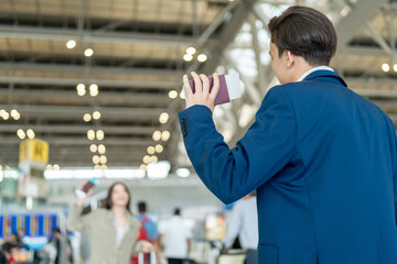 Asian business people passenger greeting each other in airport terminal. 