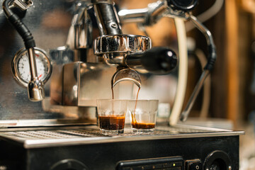 Coffee from a coffee maker Coffee pouring into a cup from a home coffee maker