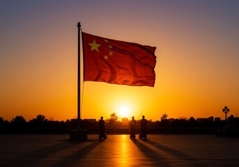 Chinese flag waving in the sunrise with soldiers at Tiananmen Square