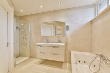 Stylish modern bathroom featuring a sleek double sink vanity, glass shower, and elegant bathtub, enhancing the contemporary aesthetic.