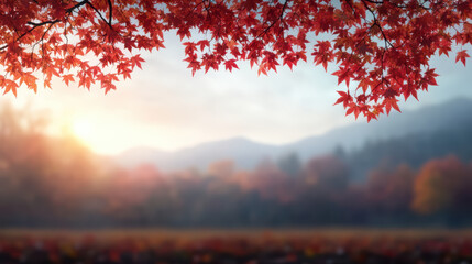 Vibrant autumn leaves frame serene landscape with mountains and soft sunset glow