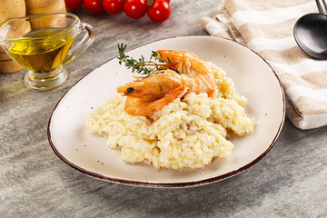 Italian risotto with prawn served thyme