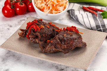 Baked beef cheeks with vegetables