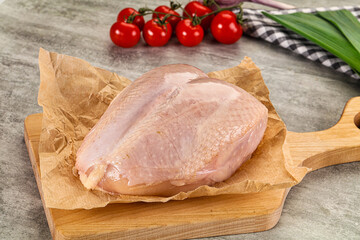 Raw chicken breast with bone