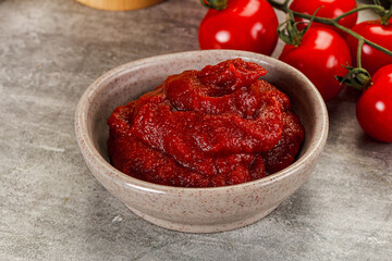 Red tomato paste in the bowl