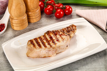 Grilled pork loin steak with bone