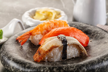 Japanese cuisine - sushi with eel, salmon and prawn