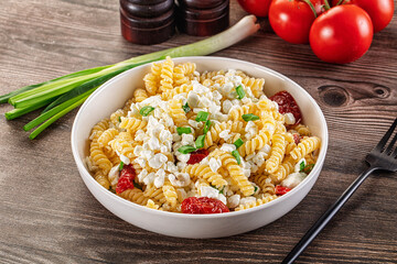 Italian pasta fusili with curd