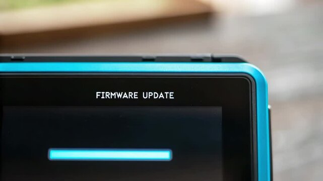 Firmware update progress bar on electronic device controls system ensuring smooth operation and efficient management in production line facility
