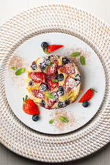 French clafoutis tart with red berries. Top view.