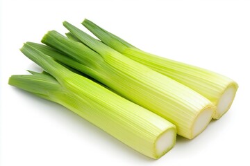 Fresh leeks arranged neatly on a white background, showcasing their vibrant green tops