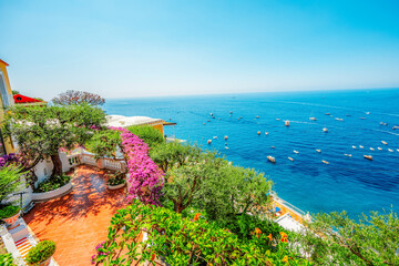 Positano coastline in south of Italy, vertiginous cliffs adorned with colorful villages, turquoise...
