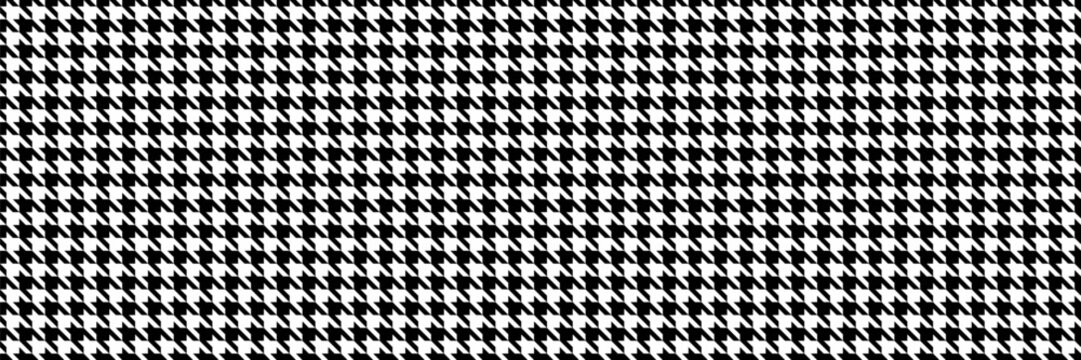 Classic black and white houndstooth pattern.  Seamless texture ideal for textile design, fashion, or website backgrounds.