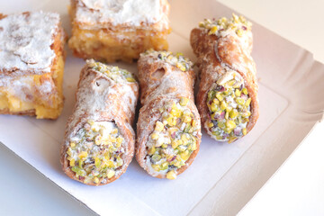 Cannoli traditional dessert of Italy. Food and sweets. Tubes of dough with filling. National cuisine. 