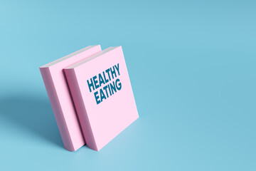 Healthy eating pink books representing nutrition and wellness on blue background