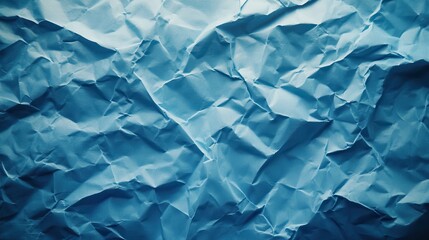 Obraz premium It shows an abstract, full frame of wrinkled blue paper texture. It can be useful for backgrounds or design with a modern, cool vibe.