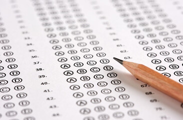 Close up view of a blank sheet of test exam paper and a pencil