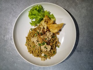 Dry Chicken Noodles with Fried Dumplings and Fresh Lettuce