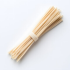Raw vegetarian asian rice noodles top view, white background