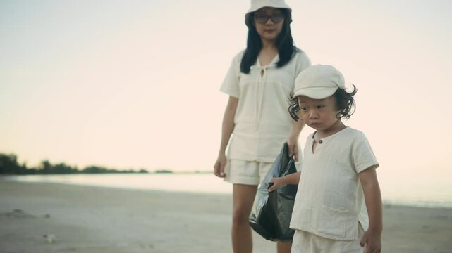 Mother teaching child to throw trash properly, promoting eco habits and responsibility through simple daily actions.

