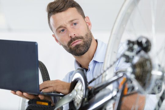 mechanic working in a bicycle repair workshop
