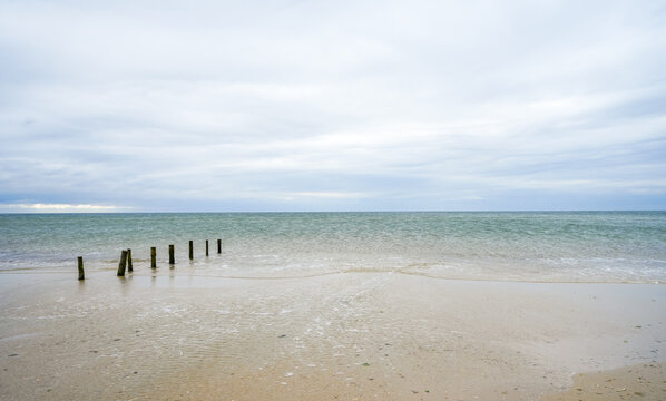 Beach landscape on R&oslash;m&oslash;. The Danish Wadden Sea island of Rem. Minimalist nature on the expansive beach.
