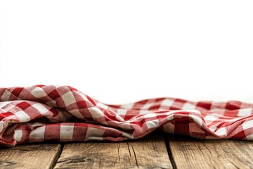 Obraz premium Red and white checkered tablecloth on a rustic wooden table