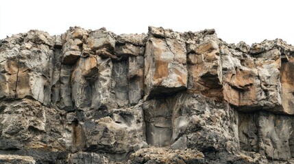 Group of volcanic rock cliffs with cracked surfaces on white background