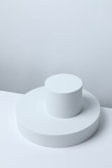 White podiums on a light background