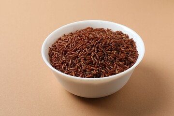 Raw white rice in a bowl on the table