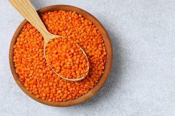 Red lentils on a gray background
