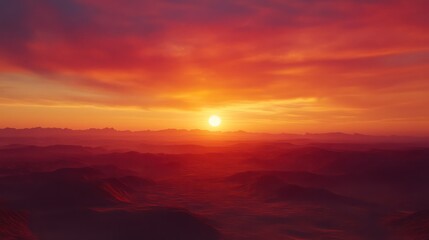 Fiery sunset over vast undulating landscape