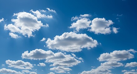 Obraz premium Fluffy White Clouds Floating in a Bright Blue Sky Daytime