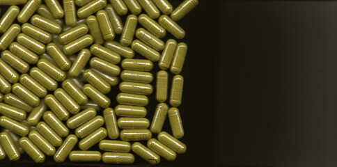 Pile of Yellow Capsules Scattered on a Dark Surface with Copy Space