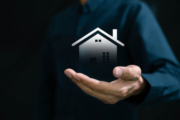 Real estate investment concept . Businessman use laptop with house icon for analyzing mortgage loan...