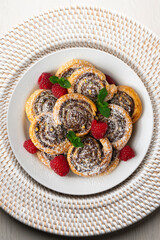 Puff pastry rolls filled with Nutella and pistachios. Top view table.