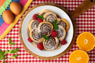 Puff pastry rolls filled with Nutella and pistachios. Top view table.